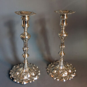 Pair of Ebenezer Cooker Georgian cast silver table candlesticks in superb condition. London 1764.